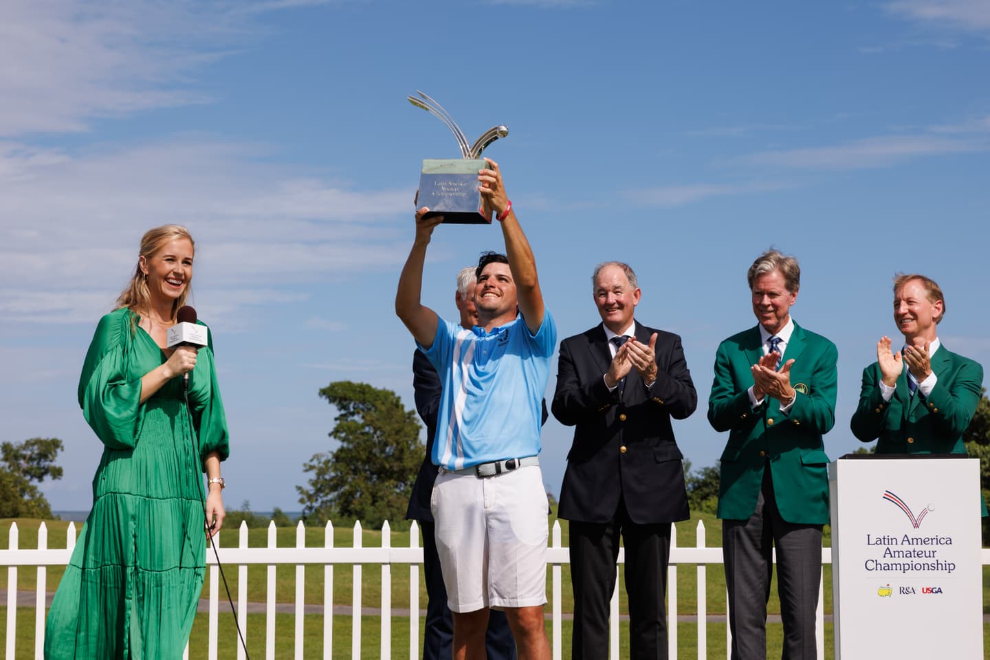 Mateo Fernandez de Oliveira of Argentina lifts the Latin America Amateur Championship trophy